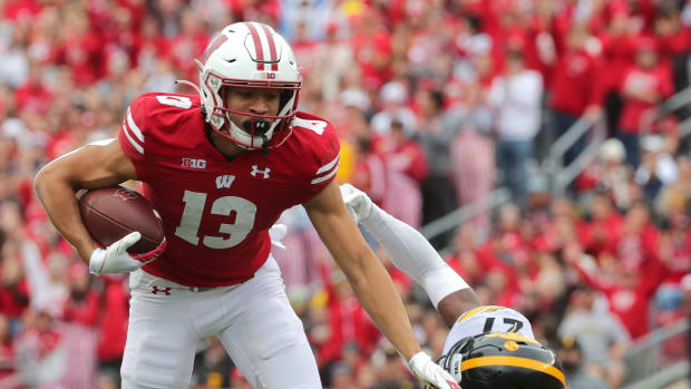 Wisconsin wide receiver Chimere Dike breaks a tackle against Iowa.